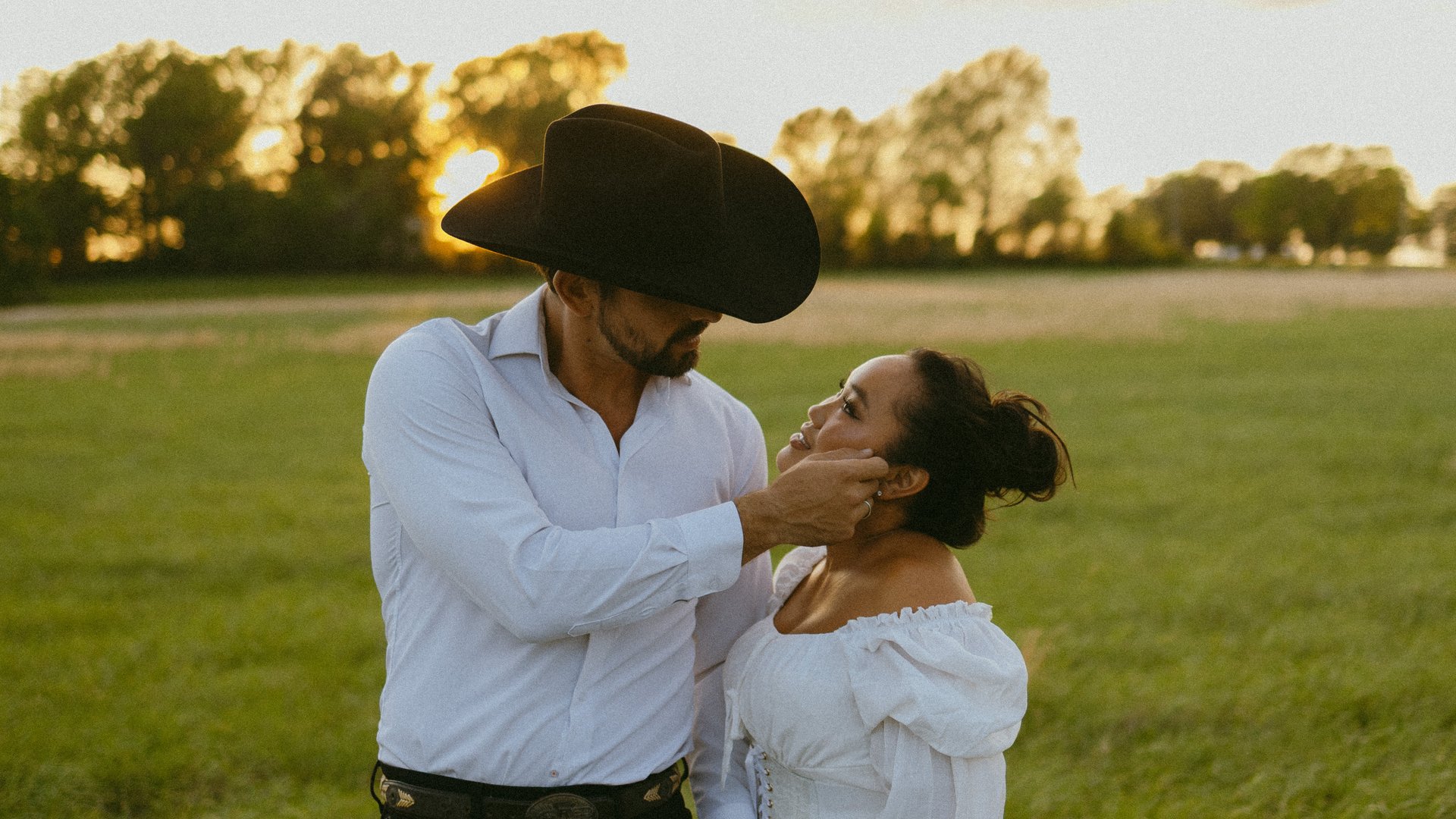 Hana and Jaydon in a golden sunset field